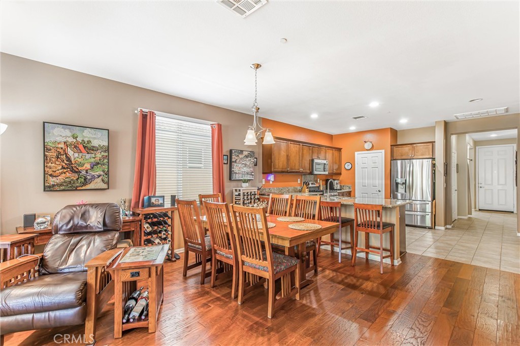 1476 Signal Peak Beaumont, CA 92223 - Photo 12 of 50 a dinning area with furniture window and wooden floor