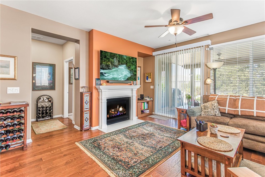 1476 Signal Peak Beaumont, CA 92223 - Photo 15 of 50 a living room with furniture a rug and a fireplace