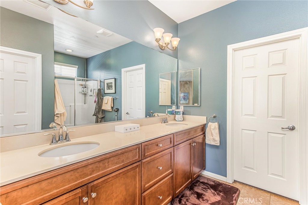 1476 Signal Peak Beaumont, CA 92223 - Photo 22 of 50 a bathroom with a sink double vanity and a mirror