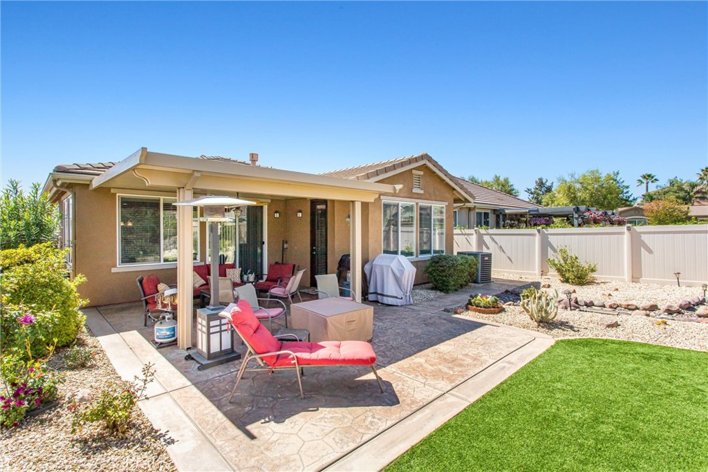 1476 Signal Peak Beaumont, CA 92223 - Photo 25 of 50 a view of a house with backyard sitting area and garden