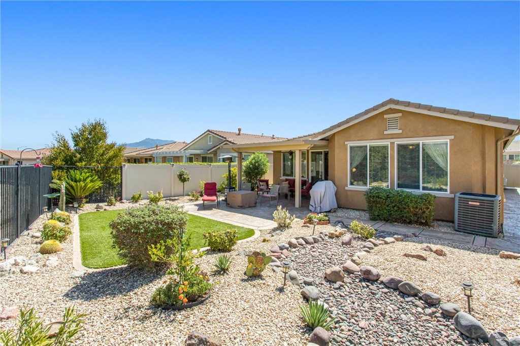 1476 Signal Peak Beaumont, CA 92223 - Photo 26 of 50 a front view of a house with a yard