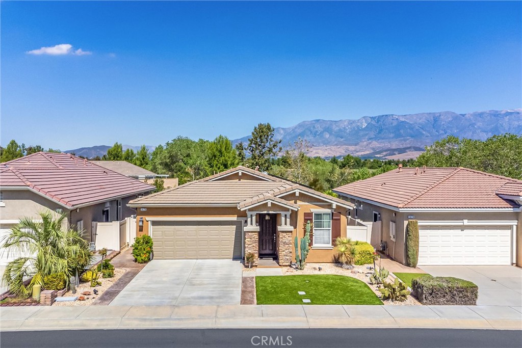 1476 Signal Peak Beaumont, CA 92223 - Photo 29 of 50 a front view of a house with a yard