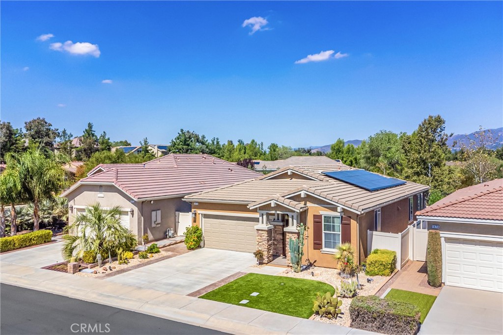 1476 Signal Peak Beaumont, CA 92223 - Photo 30 of 50 a front view of a house with garden