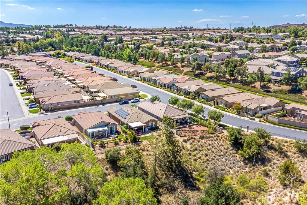 1476 Signal Peak Beaumont, CA 92223 - Photo 35 of 50 an aerial view of residential houses with outdoor space and swimming pool