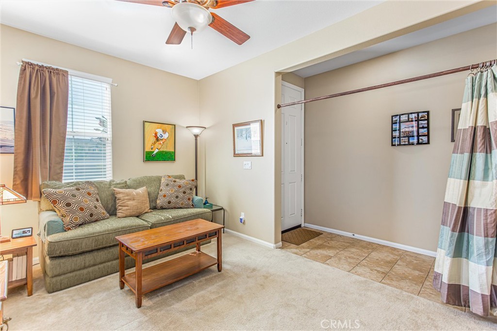 1476 Signal Peak Beaumont, CA 92223 - Photo 6 of 50 a living room with furniture and a window