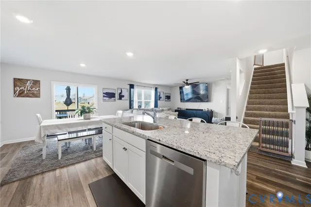 a kitchen with center island and stainless steel appliances