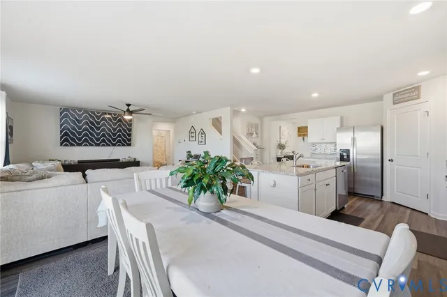 a living room with furniture and white walls