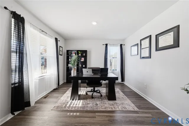 a workspace with furniture window and wooden floor