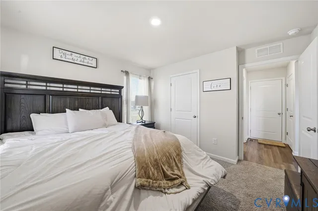 a bedroom with a bed and a walk in closet