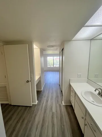 a bathroom with a sink and mirror