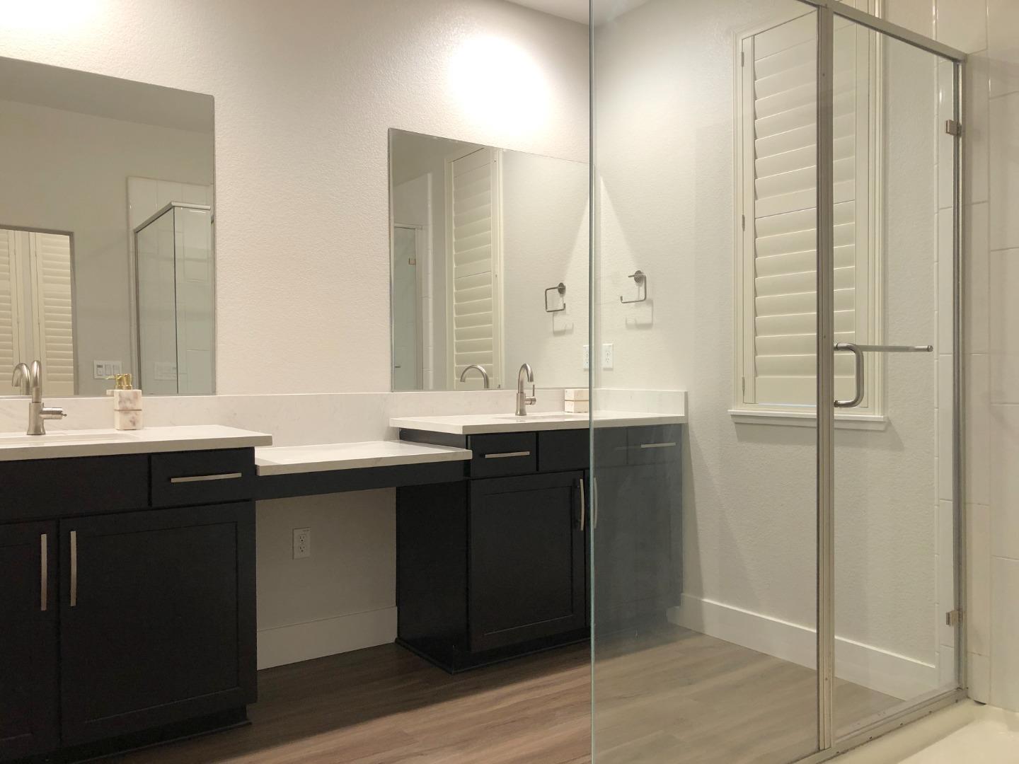 215 Houret Drive Milpitas, CA 95035 - Photo 8 of 14 a bathroom with a double vanity sink and mirror