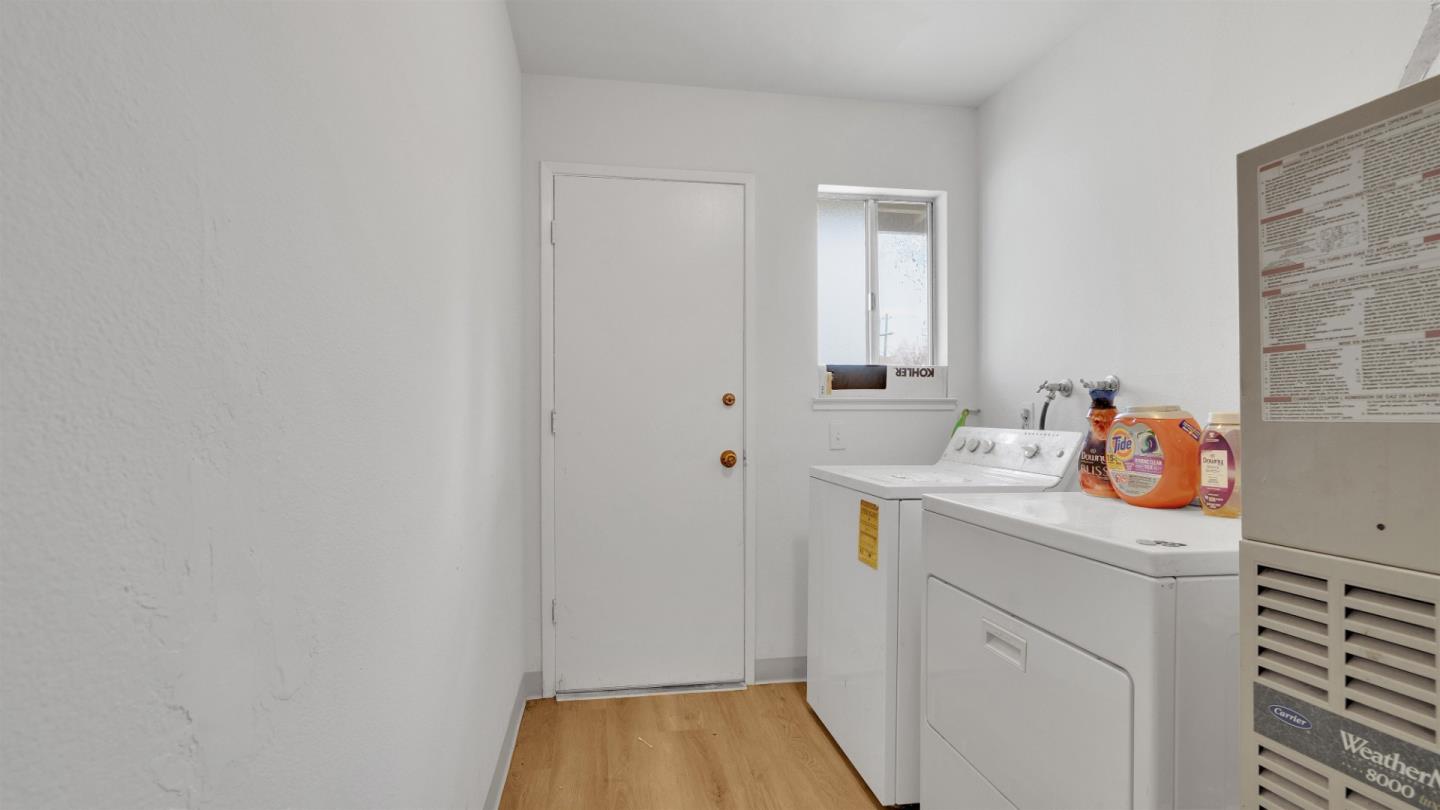 6530 Simson Street Oakland, CA 94605 - Photo 9 of 14 a utility room with a sink dryer and washer