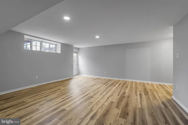 a view of an empty room and wooden floor