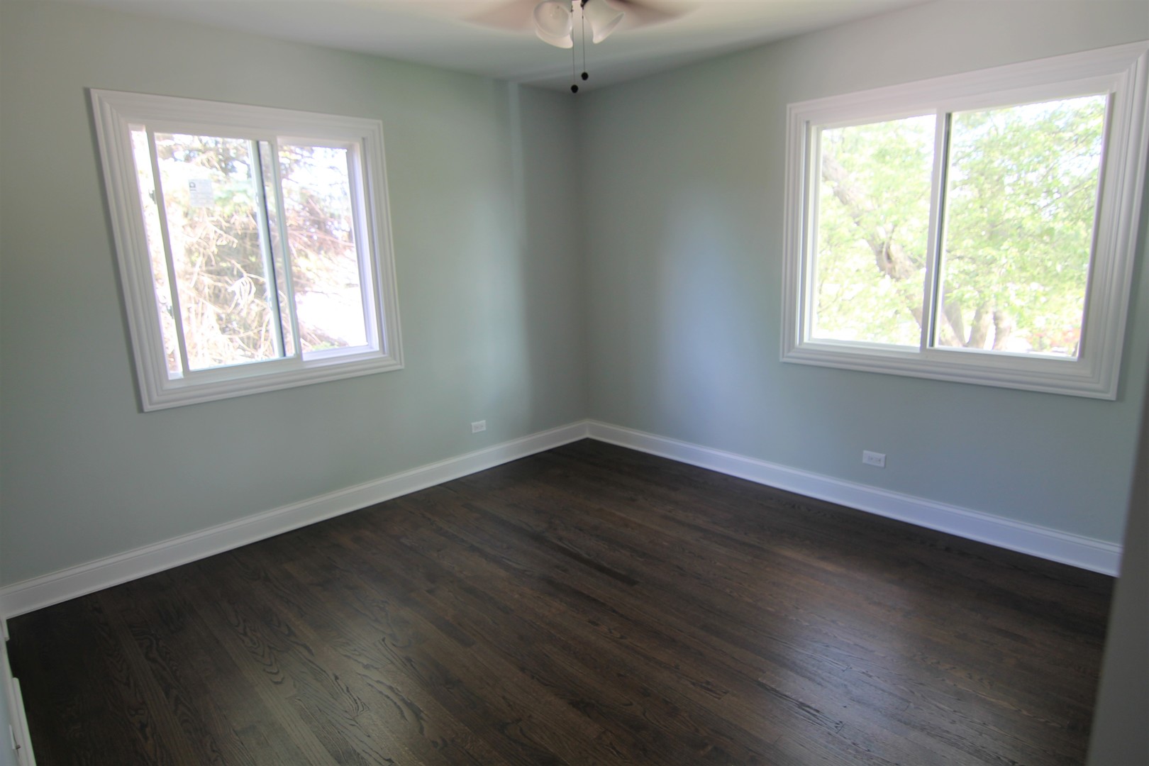 1112 Lake Cook Road Deerfield, IL 60015 - Photo 20 of 31 a view of an empty room with wooden floor and a window