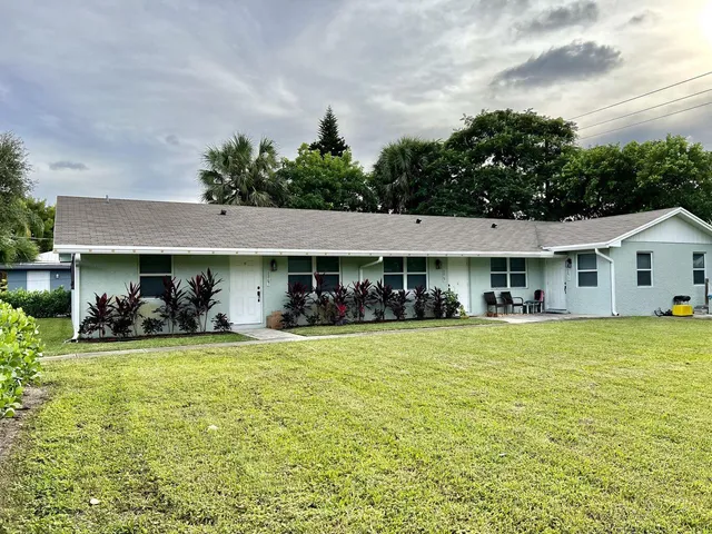 a front view of house with yard and seating area
