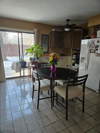 a kitchen with stainless steel appliances granite countertop a stove a sink dishwasher and cabinets with wooden floor