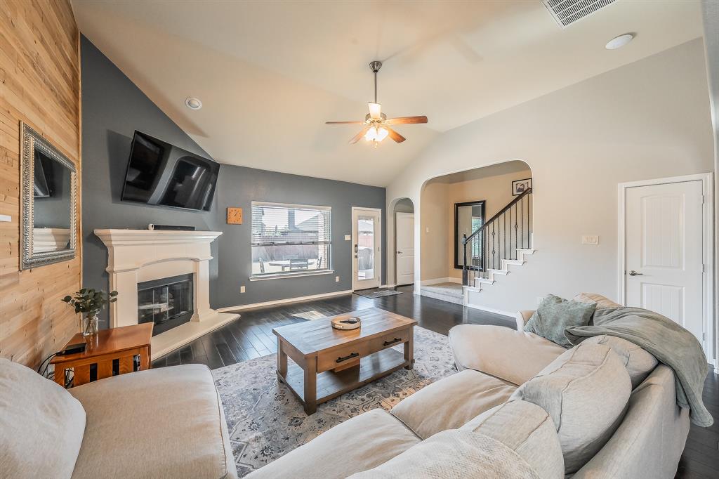10417 Boxthorn Court Fort Worth, TX 76177 - Photo 14 of 40 a living room with furniture fireplace and a flat screen tv
