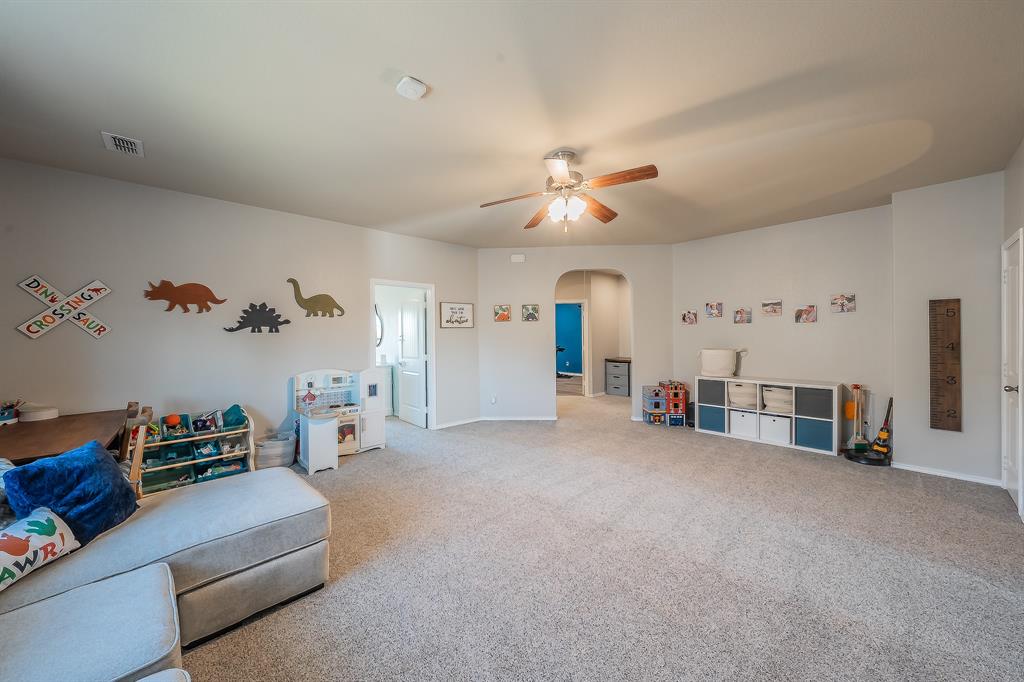 10417 Boxthorn Court Fort Worth, TX 76177 - Photo 27 of 40 a view of a livingroom with furniture and a ceiling fan