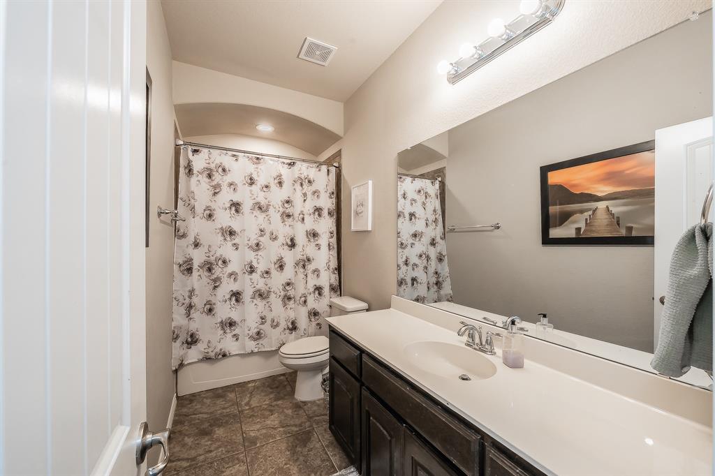 10417 Boxthorn Court Fort Worth, TX 76177 - Photo 28 of 40 a bathroom with a sink toilet and shower
