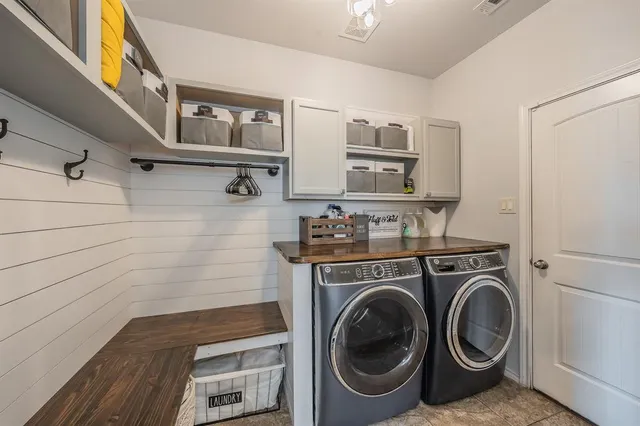 a utility room with dryer and washer