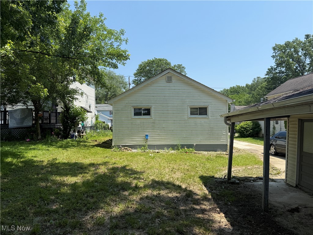 6350 Meadowbrook Road Garfield Heights, OH 44125 - Photo 11 of 28 View of side of home with a yard