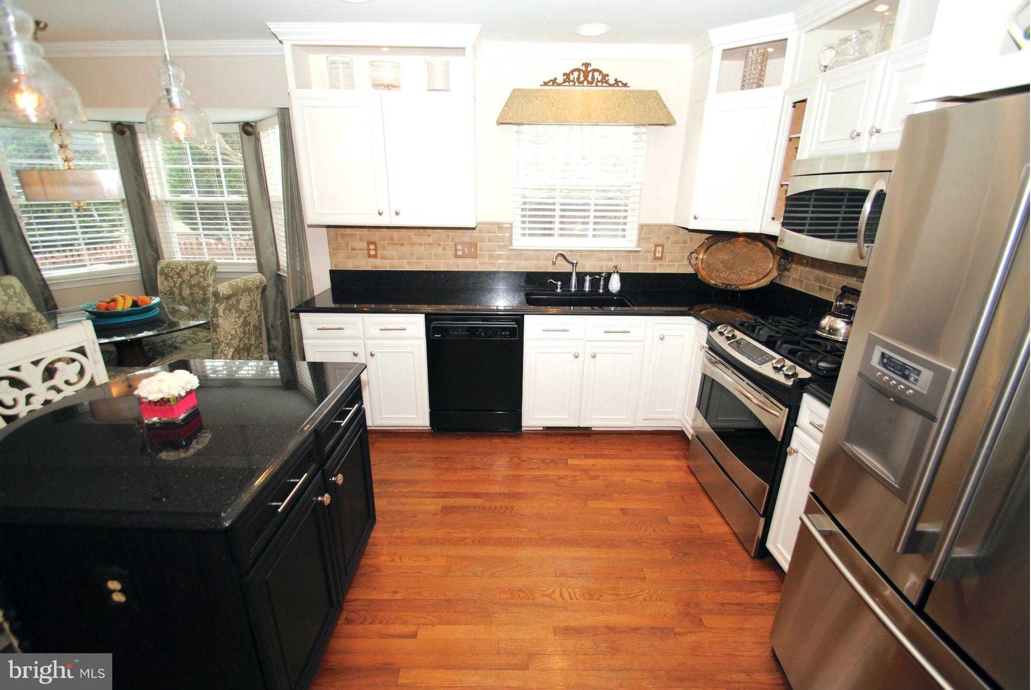 520 Broadwater Road Arnold, MD 21012 - Photo 12 of 30 Island / Dining Bar Kitchen with Hardwood Floors