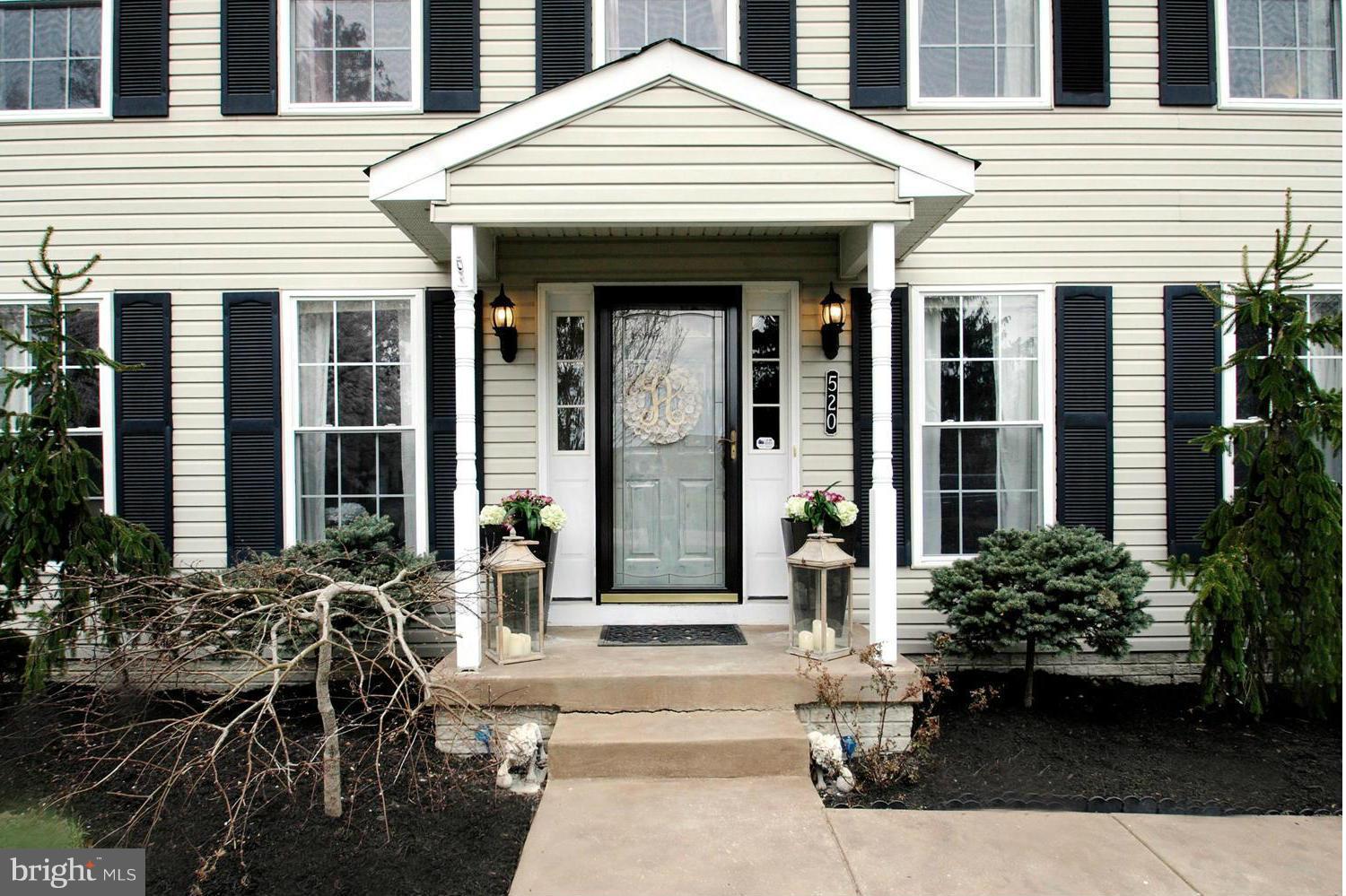 520 Broadwater Road Arnold, MD 21012 - Photo 9 of 30 Exotic Landscaping Bordering Entrance Portico