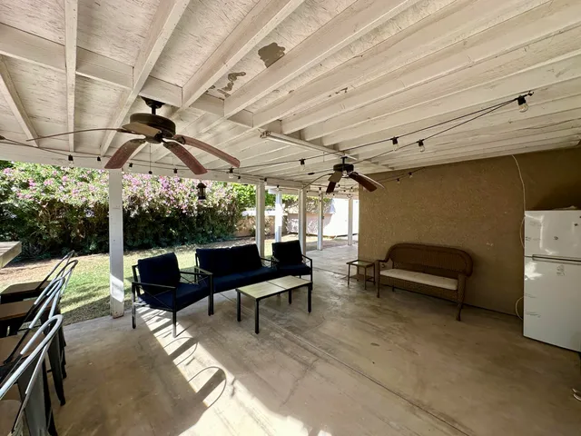 a view of a chairs and couch in a room