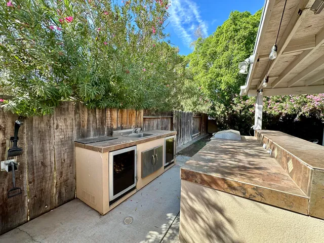 a view of a kitchen from a backyard