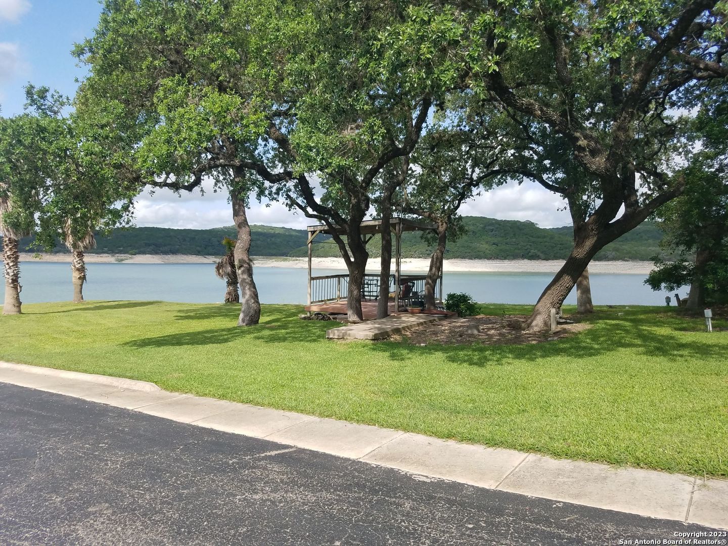 955 Faurie Road, Unit CEDAR CABIN Lakehills, TX 78063 - Photo 18 of 21 a view of a backyard with tree s