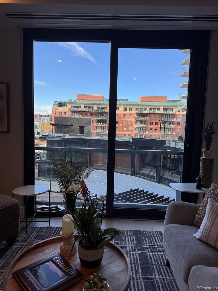 1901 Wazee Street, Unit 412 Denver, CO 80202 - Photo 25 of 33 a living room with furniture tv and a floor to ceiling window