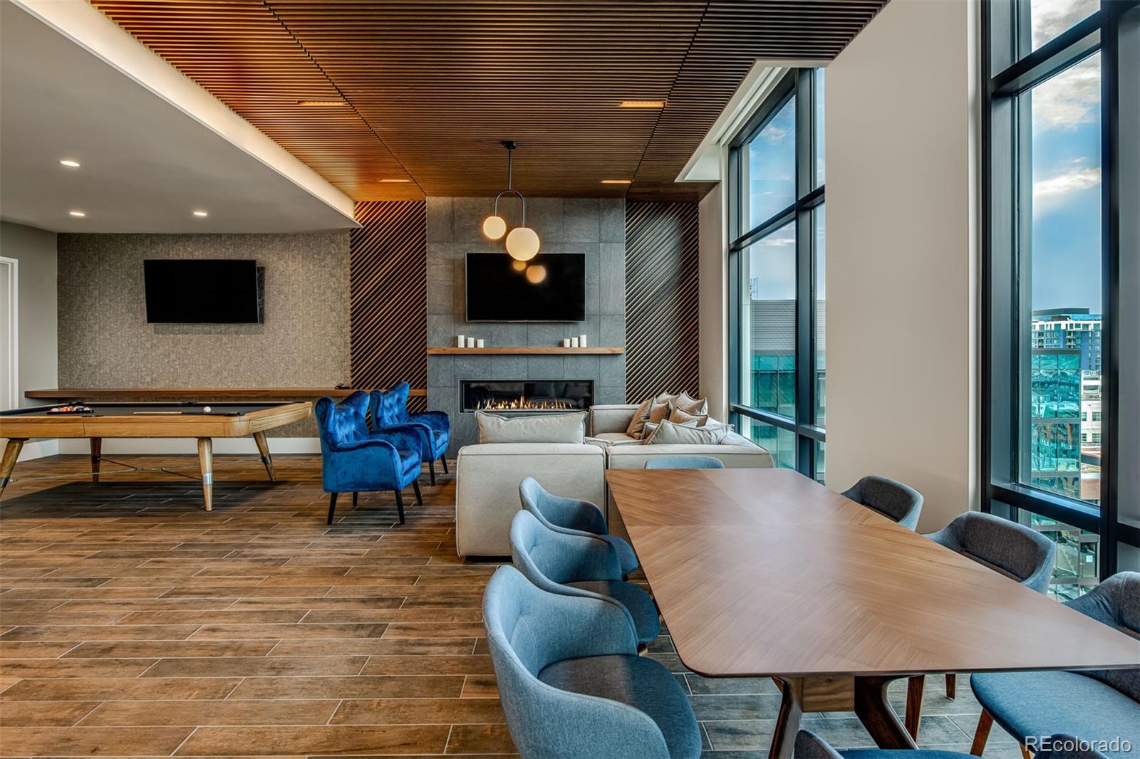 1901 Wazee Street, Unit 412 Denver, CO 80202 - Photo 10 of 33 a living room with furniture a flat screen tv and a large window