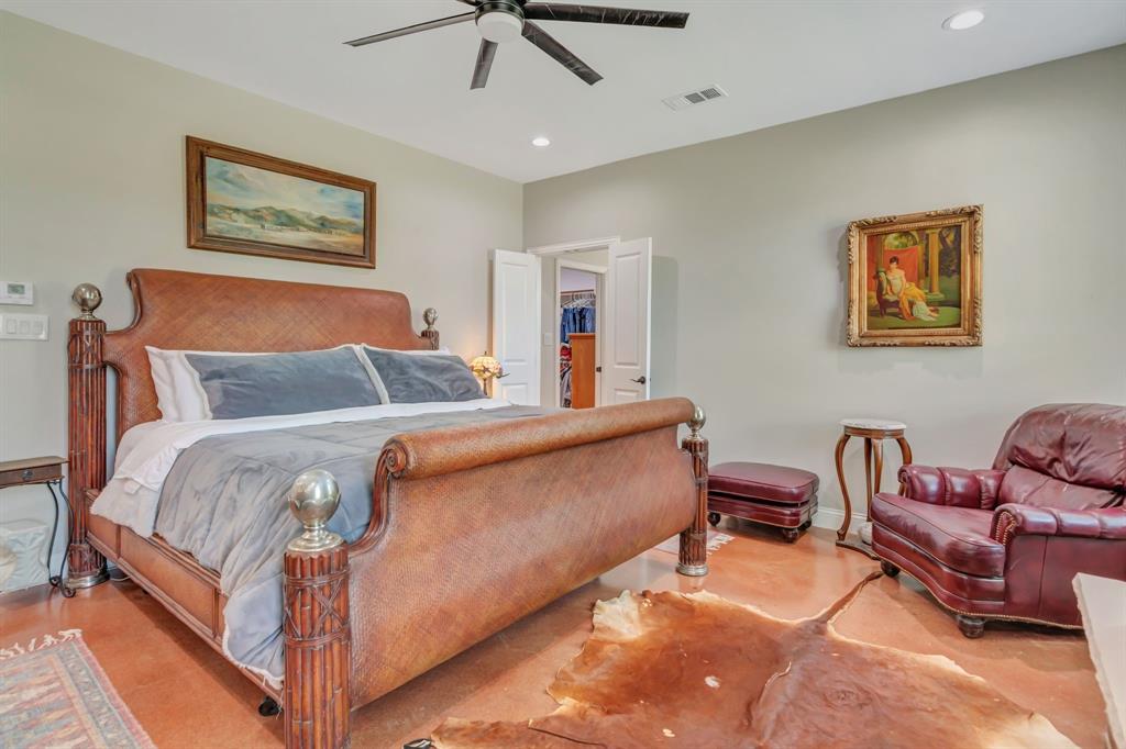 129 Whiskey Rnch Road Runaway Bay, TX 76426 - Photo 21 of 39 a bedroom with a bed and a couch