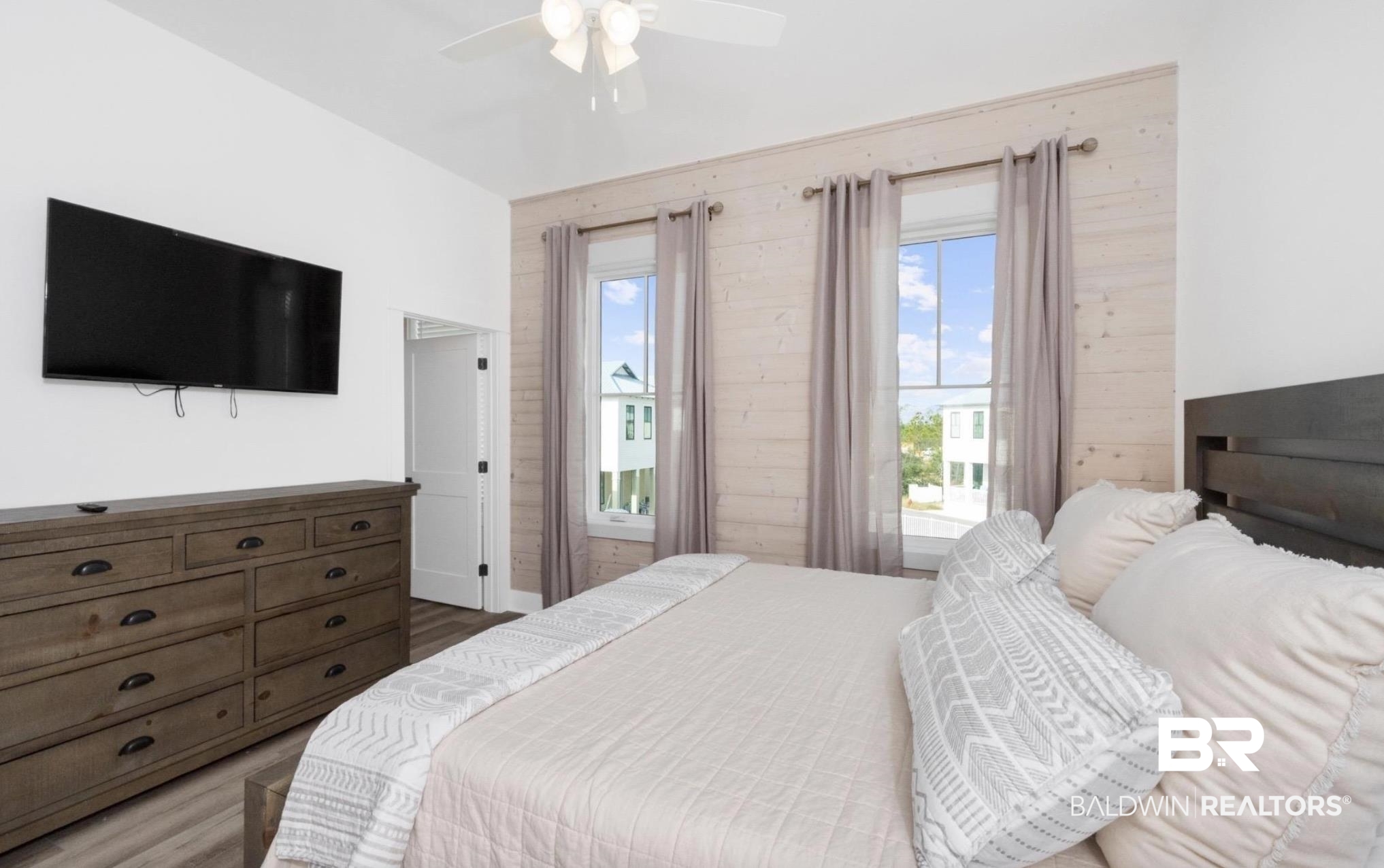 20 West Gate Orange Beach, AL 36561 - Photo 9 of 15 Bedroom with ceiling fan and wood finished floors