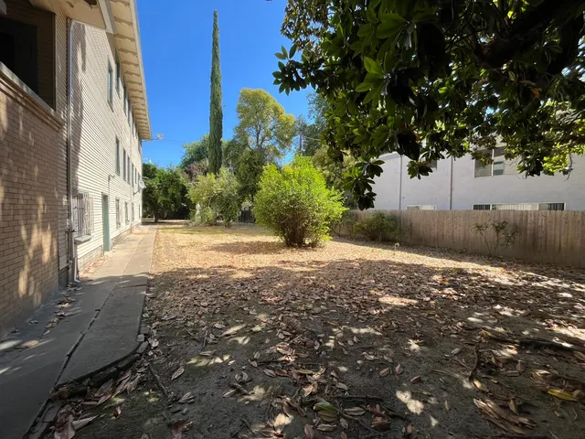 a view of a backyard of the house