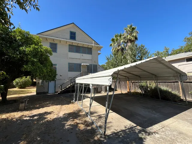 a view of an empty room with a fireplace