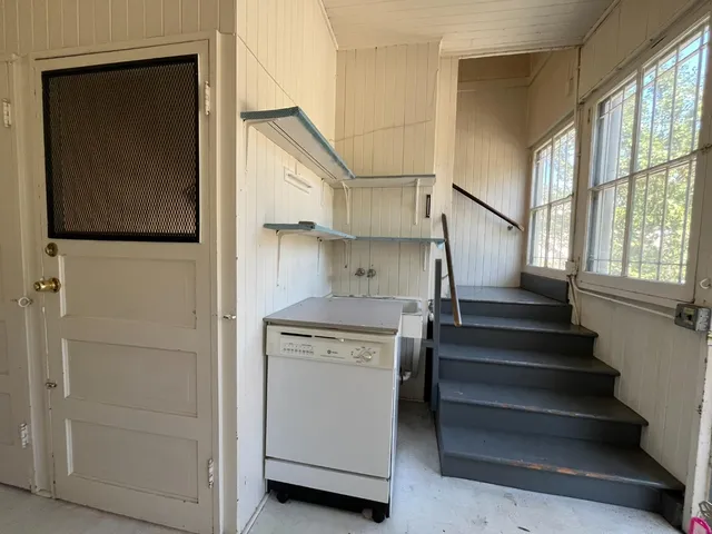 a view of empty room with windows