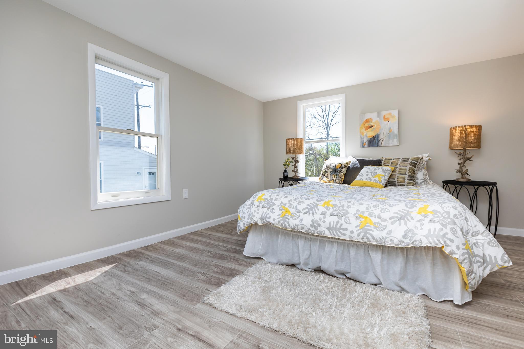 2407 Hammonds Ferry Road Halethorpe, MD 21227 - Photo 25 of 43 a bedroom with a bed and window