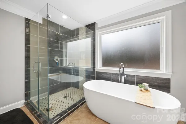 a bathroom with a tub and a sink