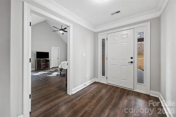 a view of livingroom with hardwood floor and a fireplace
