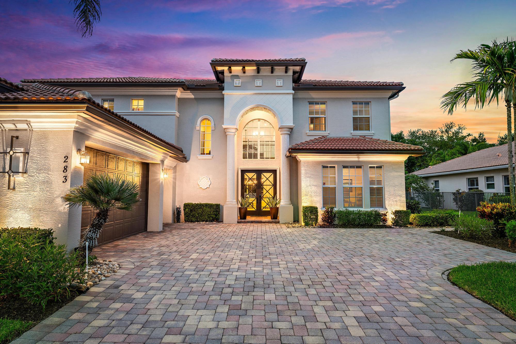 283 Rudder Cay Way Jupiter, FL 33458 - Photo 15 of 41 a front view of a house with a yard