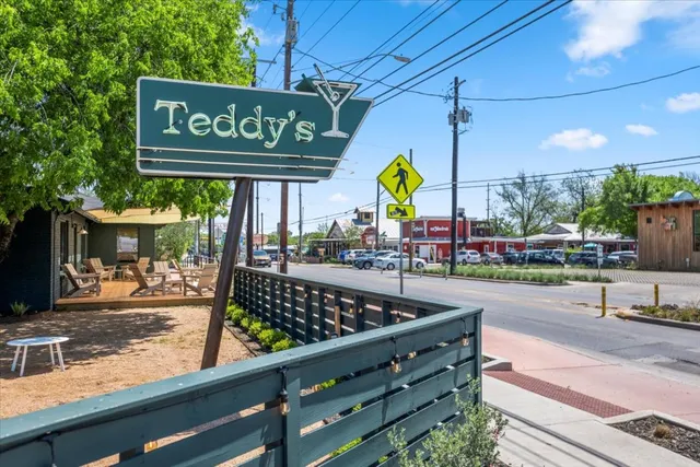a view of a street with sitting area