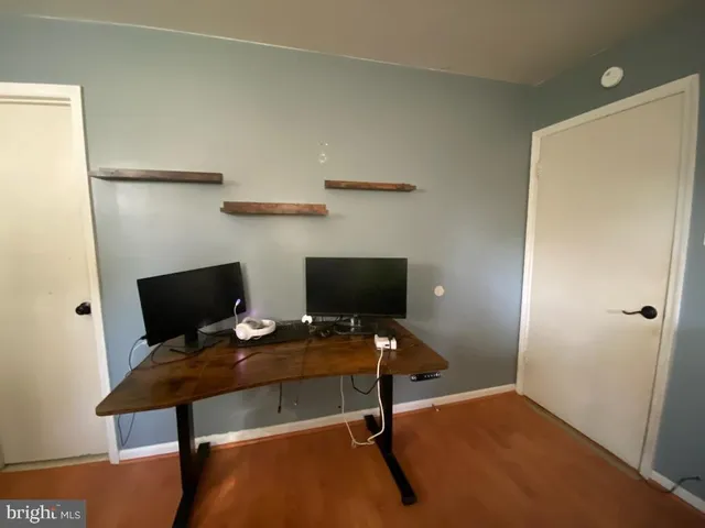 a view of a workspace with furniture