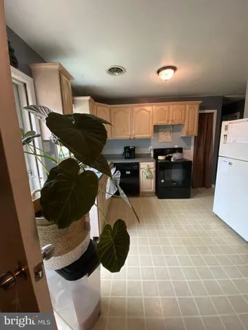 a kitchen with a cabinets and appliances