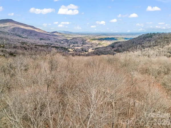 an aerial view of a house with swimming pool garden and outdoor seating
