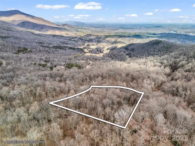 a view of roof and mountain