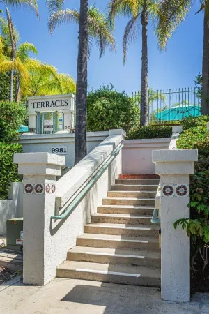 a view of building with yard and swimming pool