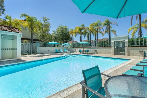 a view of a swimming pool with a patio