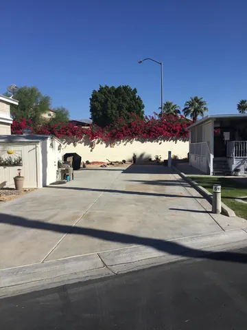 a view of a house with a street