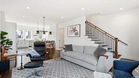 a living room with furniture or couch and a potted plant